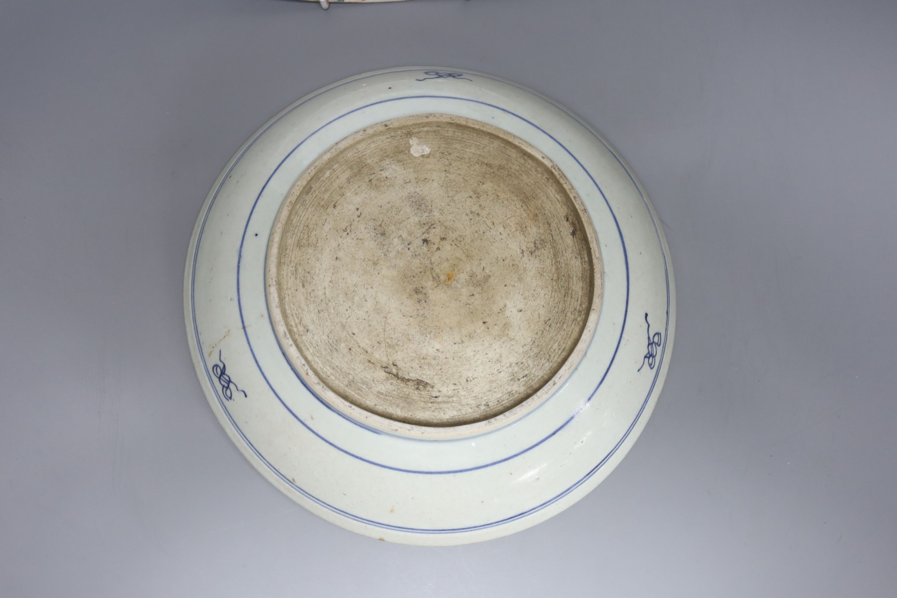 A Chinese thousand flower enamelled porcelain dish, 20th century, 40.5cm, and a mid 19th century Chinese blue and white dish, 26.5cm